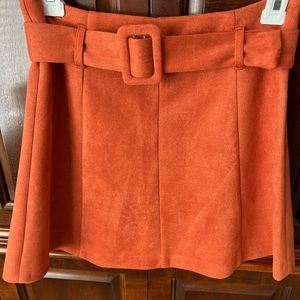 Orange velvet/felt skirt pleated with belt. Size small never worn.
